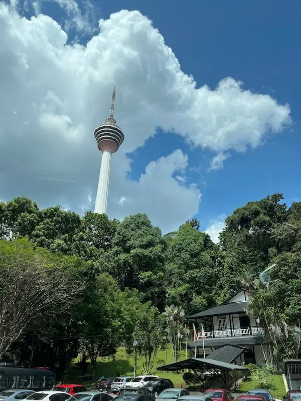 Car park and old building with KL Tower looming above